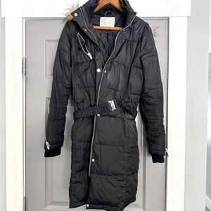 Woman’s puffer black coat with belt and removable hood